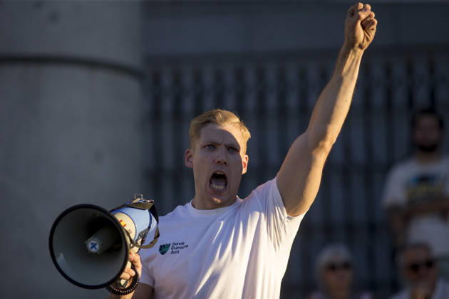 August 29, 2026, Madrid, Madrid, Spain: TONI ESTEVEZ of the Spanish far-right group Reconquista shouts through a megaphone during a rally of far-right groups Europe Save Act, Revuelta, and Reconquista, waving Spanish flags, in Madrid s Plaza de la Armeria, to unfurl a giant banner in support of remigration. Madrid Spain - ZUMAs296 20260829_znp_s296_005 Copyright: xLuisxSotox