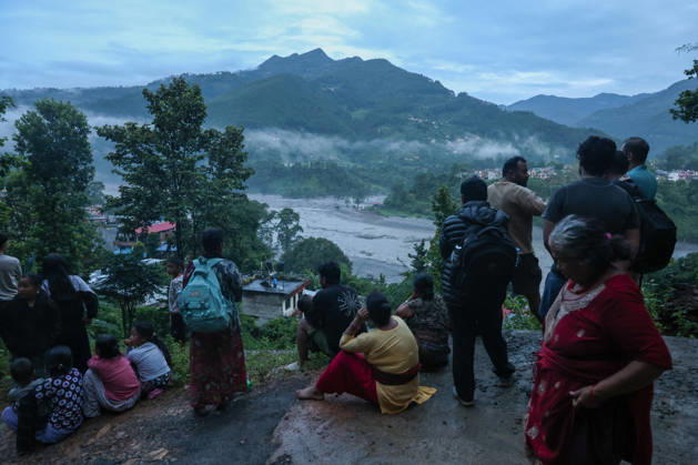 People in Nepal flee homes amid flash flood warning BIDUR, NEPAL - AUGUST 30: Residents living along Trishuli River take shelter at higher ground after fleeing homes early in the morning, as authorities issue new flash flood warning, in Bidir, Nuwakot, Nepal, on August 30, 2026. More than 2,000 people remain missing while hundreds of people have died, following the flash flood and landslide near the Nepal-China border earlier. Among the missing foreign nationals include those from China, India, the United States, Australia, the United Kingdom and South Korea. Daniel Ceng Anadolu Bidur Nepal. Editorial use only. Please get in touch for any other usage. Copyright: x2026xAnadoluxDanielxCengx