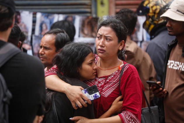 Nepal Floods - Aftermath Relatives of people missing after flash floods in Rasuwa and Nuwakot cry while searching for their loved ones at Tribhuvan University Teaching Hospital on August 30, 2026. Families examine photographs and missing-person notices as search and identification efforts continue. The floods destroyed homes and swept mud and debris downstream along the Trishuli River. Kathmandu Nepal Copyright: xSanjitxPariyarx originalFilename: pariyar-notitle260830_npUiI