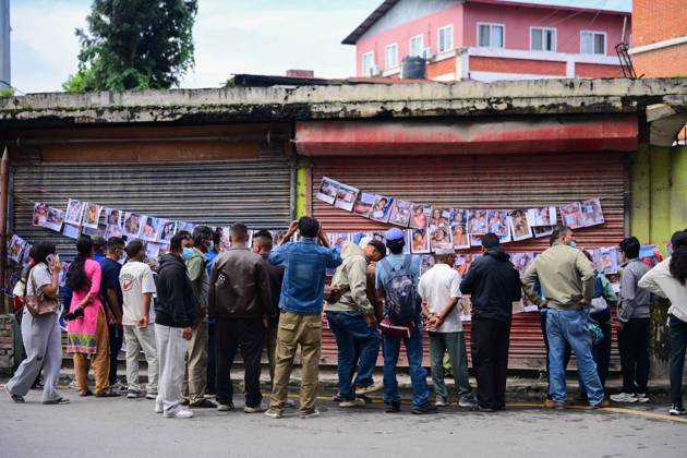 August 30, 2026, Kathmandu, Bagmati, Nepal: KATHMANDU, NEPAL, AUGUST 30, 2026: Relatives search for missing family members at Tribhuvan University Teaching Hospital in Kathmandu, four days after flash floods struck Rasuwa and Nuwakot districts near the Nepal-China border. Families post photographs of missing loved ones on walls and noticeboards and examine missing-person notices as search, rescue and identification efforts continue. The floods swept through communities before surging downstream along the Trishuli River, damaging homes and infrastructure and leaving families awaiting information about those still unaccounted for. Kathmandu Nepal - ZUMAq101 20260830_zna_q101_039 Copyright: xSafalxPrakashxShresthax