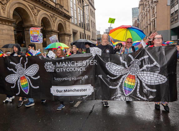 August 29, 2026, Manchester, United Kingdom: Manchester Bee on Manchester Council banner seen during the pride parade. Revelers refused to let a heavy downpour dampen their spirits as the annual parade makes its way through the city centre. Despite the torrential rain, the LGBTQ+ community and supporters partied anyway, filling the streets with vibrant colour, music, and joy. The festival has been officially renamed Manchester Village Pride this year, marking a new community-led chapter after the voluntary liquidation and financial collapse of the former organizing company last autumn. Taking part in the celebrations, the newly elected Mayor of Greater Manchester, Bev Craig, actively engaged with parade participants and cheering crowds alon  - ZUMAs197 20260829_aaa_s197_353 Copyright: xGaryxRobertsx