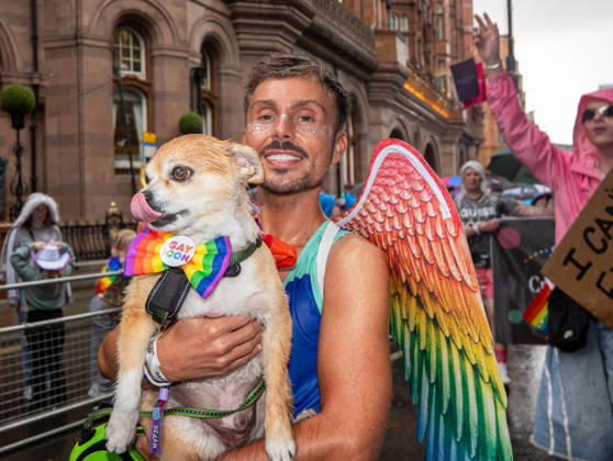 August 29, 2026, Manchester, United Kingdom: Dog and owner brave the rain during the pride parade. Revelers refused to let a heavy downpour dampen their spirits as the annual parade makes its way through the city centre. Despite the torrential rain, the LGBTQ+ community and supporters partied anyway, filling the streets with vibrant colour, music, and joy. The festival has been officially renamed Manchester Village Pride this year, marking a new community-led chapter after the voluntary liquidation and financial collapse of the former organizing company last autumn. Taking part in the celebrations, the newly elected Mayor of Greater Manchester, Bev Craig, actively engaged with parade participants and cheering crowds along the route through - ZUMAs197 20260829_aaa_s197_351 Copyright: xGaryxRobertsx