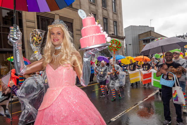 August 29, 2026, Manchester, United Kingdom: Drag queen carries a cake with an umbrella during the pride parade. Revelers refused to let a heavy downpour dampen their spirits as the annual parade makes its way through the city centre. Despite the torrential rain, the LGBTQ+ community and supporters partied anyway, filling the streets with vibrant colour, music, and joy. The festival has been officially renamed Manchester Village Pride this year, marking a new community-led chapter after the voluntary liquidation and financial collapse of the former organizing company last autumn. Taking part in the celebrations, the newly elected Mayor of Greater Manchester, Bev Craig, actively engaged with parade participants and cheering crowds along the  - ZUMAs197 20260829_aaa_s197_373 Copyright: xGaryxRobertsx