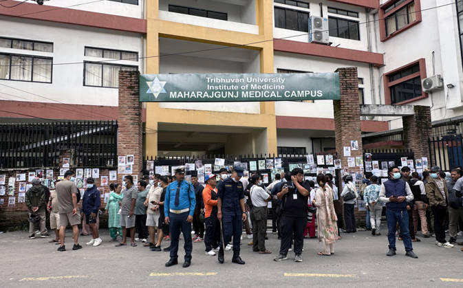 August 30, 2026, Kathmandu, Nepal: Family members gather outside a hospital to check photographs of missing people as they await information about their loved ones at Tribhuvan University Teaching Hospital in Maharajgunj, Kathmandu,Nepal on August 30, 2026. Recovered bodies are being kept at the hospital for identification and post-mortem examinations following the devastating floods in Rasuwa.According to authorities, 734 people had died and 2,498 remained missing as morning of Aug. 30, 2026, following devastating flash floods that struck areas near the Nepal-China border on Aug. 26. Kathmandu Nepal  - ZUMAs233 20260830_zap_s233_004 Copyright: xSunilxSharmax