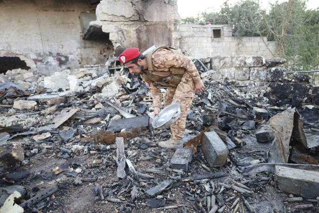 Binnish Syria Ammunition Explosion A uniformed man inspects debris at the site of an explosion in Binnish, Idlib Governorate, Syria, on September 1, 2026. Five people were killed and several others injured when a vehicle loaded with ammunition exploded in Binnish, according to Syrian authorities, while the cause remained unclear and emergency crews worked to secure scattered munitions and prevent further explosions. Binnish Idlib Syria Copyright: xOmarxAlbawx