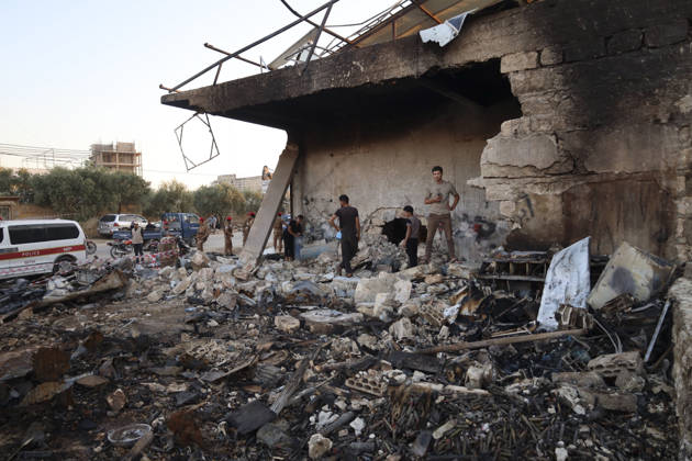 Binnish Syria Ammunition Explosion People inspect a damaged building and debris at the site of an explosion in Binnish, Idlib Governorate, Syria, on September 1, 2026. Five people were killed and several others injured when a vehicle loaded with ammunition exploded in Binnish, according to Syrian authorities, while the cause remained unclear and emergency crews worked to secure scattered munitions and prevent further explosions. Binnish Idlib Syria Copyright: xOmarxAlbawx