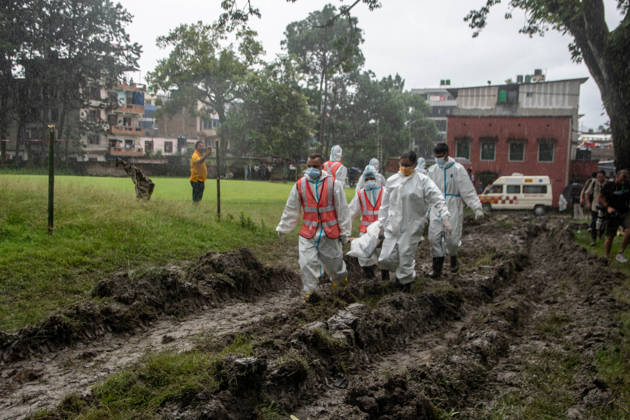 September 1, 2026, Kathmandu, Nepal: Bodies of unidentified victims wrapped in shrouds lie at a temporary burial trench in Gokarna, Kathmandu. Emergency teams collected DNA samples and forensic records prior to interment to assist family identification efforts later. Kathmandu Nepal - ZUMAs197 20260901_aaa_s197_247 Copyright: xAmitxShuklax