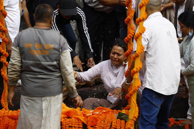 September 2, 2026, Kathmandu, Nepal: Relatives perform the final rites of Suraj Timilsina, 32, using a symbolic effigy made of straw and barley grains after his body could not be recovered following the devastating floods, at Pashupatinath Temple in Kathmandu, Nepal, on Wednesday, September 2, 2026. Suraj, originally from Sindhupalchok, was involved in an import-export and transport business in Timure, Rasuwa, and was swept away by the floods. He is survived by his wife, Ayusha Timilsina, 27, and their six-year-old son and three-year-old daughter. As thousands remain missing and many bodies have yet to be recovered, families have begun performing final rites for loved ones without their remains. The floods have killed more than 1,000 people - ZUMAg200 20260902_zap_g200_004 Copyright: xSkandaxGautamx