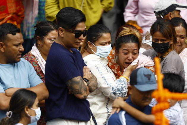 September 2, 2026, Kathmandu, Nepal: Ayusha Timilsina, 27, mourns the death of her husband, Suraj Timilsina, 32, while cremating a symbolic effigy made of straw and barley grains after his body could not be recovered following the devastating floods, at Pashupatinath Temple in Kathmandu, Nepal, on Wednesday, September 2, 2026. Suraj, originally from Sindhupalchok, was involved in an import-export and transport business in Timure, Rasuwa, and was swept away by the floods. He is survived by his wife and their six-year-old son and three-year-old daughter. As thousands remain missing and many bodies have yet to be recovered, families have begun performing final rites for loved ones without their remains. The floods have killed more than 1,000 p - ZUMAg200 20260902_zap_g200_006 Copyright: xSkandaxGautamx