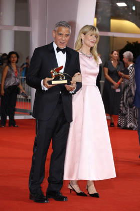 Venise 2026 Ink Screening George Clooney Golden Lion NB George Clooney poses with Laura Dern after receiving the Golden Lion for Lifetime Achievement Award attending the Ink Red carpet Opening Ceremony as part of the 83th Venice International Film Festival at the Lido in Venice, Italy on September 02, 2026. Photo by Nasser Berzane ABACAPRESS.COM Venise Copyright: xBerzanexNasser ABACAx