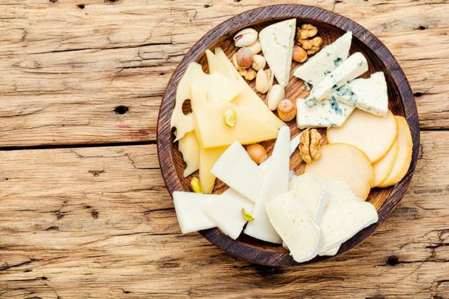 Cheese on the table.various types of cheese on old rustic wooden table Copyright: xLMykolax Panthermedia78525810