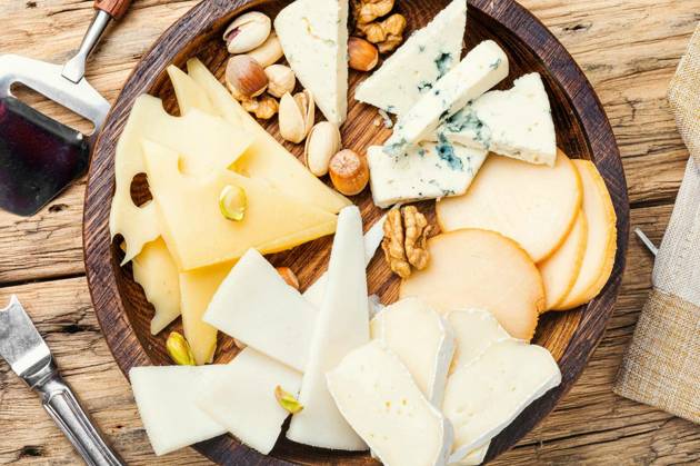 Cheese on the table.various types of cheese on old rustic wooden table Copyright: xLMykolax Panthermedia78525818
