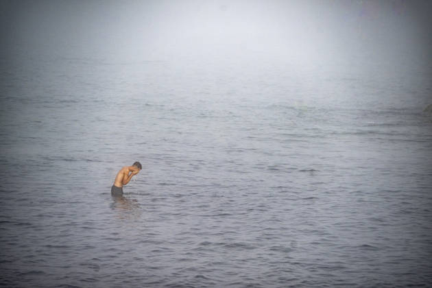Settlements Continue on El Trampolín Beach A migrant takes a bath on El Trampolín Beach, September 7, 2026, in Ceuta, Spain. Despite having been cleared, the camp on El Trampolín Beach resembles a makeshift city and remains occupied by people who continue to arrive in Ceuta. SEPTEMBER 7, 2026, Ceuta, Spain  Copyright: xMarcosxMorenox 7756364