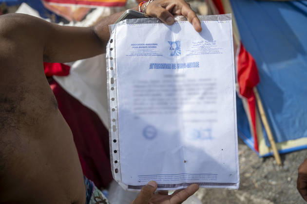 Settlements Continue on El Trampolín Beach A migrant shows his certificate of deafness and muteness on El Trampolín Beach, September 7, 2026, in Ceuta, Spain. Despite having been cleared, the camp on El Trampolín Beach resembles a makeshift city and remains occupied by people who continue to arrive in Ceuta. SEPTEMBER 7, 2026 Ceuta, Spain  Copyright: xMarcosxMorenox 7756386