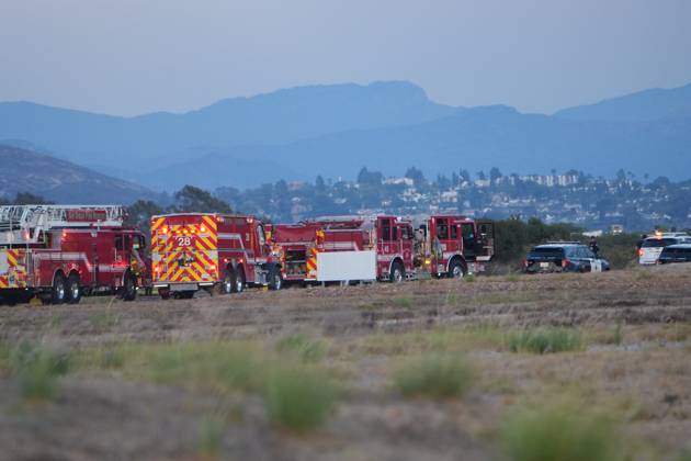 September 7, 2026, San Diego, California, United States: Firefighters from San Diego Fire-Rescue respond to the scene after the plane crashes at the runway..A small plane crashes and catches fire on the runway at Montgomery-Gibbs Executive Airport in Kearny Mesa of San Diego. Two people are killed in the crash, which is reported at about 5:20 p.m., according to San Diego police and fire-rescue officials. The Federal Aviation Administration temporarily close the airport as crews work at the scene and investigators begin determining the cause of the crash. San Diego United States - ZUMAs197 20260907_aaa_s197_592 Copyright: xWaixLeexMichaelxHox