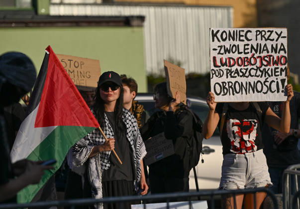 Anti-Israel Rally Outside Opening Day Of MSPO 2026 Defense Salon In Kielce KIELCE, POLAND - SEPTEMBER 8: Protesters wave a Palestinian flag, wear traditional keffiyehs, and hold hand-painted signs--including one reading End the permission for genocide under the guise of defense! during an anti-Israel demonstration organized by the Expos Without Criminals coalition outside the Targi Kielce exhibition center gates to demand the exclusion of Israeli weapons companies on the opening day of the 34th International Defence Industry Exhibition (MSPO) on September 8, 2026. Kielce Poland  Copyright: xArturxWidakx originalFilename: widak-antiisra260908_npe35.jpg