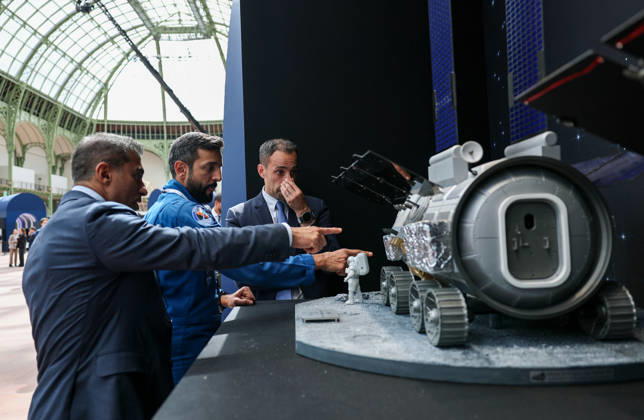 (260909) -- PARIS, Sept. 9, 2026 -- Visitors check an exhibit during the International Space Summit at the Grand Palais in Paris, France, Sept. 9, 2026. The first International Space Summit opened Wednesday in Paris, bringing together heads of state and government, scientists, astronauts and industry representatives. ) FRANCE-PARIS-INTERNATIONAL SPACE SUMMIT WuxHuiwo 