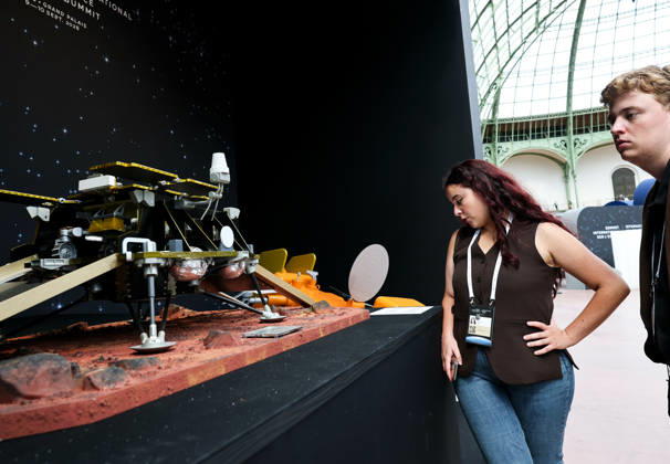 (260909) -- PARIS, Sept. 9, 2026 -- Visitors check an exhibit during the International Space Summit at the Grand Palais in Paris, France, Sept. 9, 2026. The first International Space Summit opened Wednesday in Paris, bringing together heads of state and government, scientists, astronauts and industry representatives. ) FRANCE-PARIS-INTERNATIONAL SPACE SUMMIT WuxHuiwo 