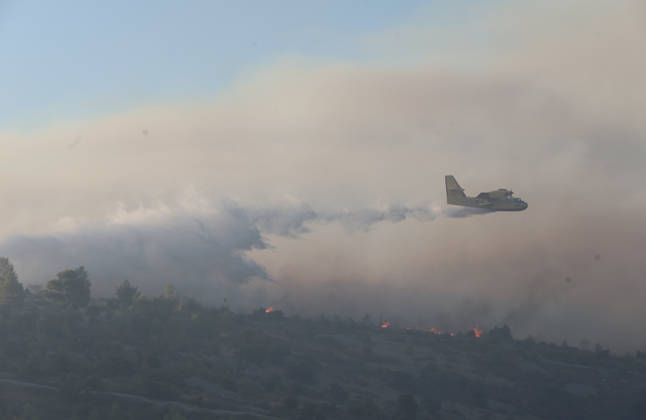 Croatia Island Wildfire A Croatian Canadair CL-415 firefighting plane drops water on a wildfire near city Milna at Island Brac, Croatia on September 12, 2026.  IvoxCagalj PIXSELL