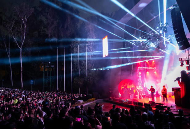 October 2, 2026, San Luis Potosi, San Luis Potosi, Mexico: A wide-angle view from behind the crowd shows the elaborate lighting rig with beams of blue and red light illuminating the stage where members of ESLABON ARMADO perform live at Teatro de la Ciudad in Parque Tangamanga 1 in San Luis Potosi, Mexico. San Luis Potosi Mexico - ZUMAm311 20261002_zip_m311_003 Copyright: xAlbertoxMartinezx
