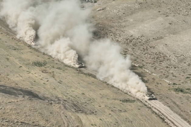 TAJIKISTAN - OCTOBER 3, 2026: Russian tank crews destroy a simulated enemy during the Tsentr Centre 2026 military exercise held at the Lyaur training ground. Video screen grab. Best quality available. Russian Defence Ministry TASS  98708975