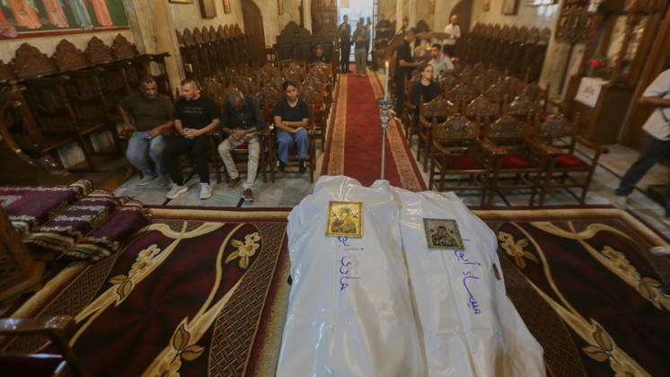 October 3, 2026, Gaza City, Gaza Strip, Palestinian Territory: Palestinian Christians gather to bid farewell and pray beside the bodies of Maysaa Abu Daoud and her daughter, Mary Abu Daoud, who were killed in an Israeli airstrike that targeted a residential apartment in western Gaza City. Funeral prayers are held at St. Porphyrios Church in the Zeitoun neighborhood of southeastern Gaza City. Gaza City Palestinian Territory - ZUMAz119 20261003_zip_z119_037 Copyright: xSalahxHashemx