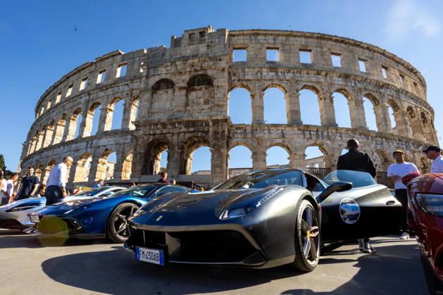 Ferrari Tour stops in Pula Luxury Ferrari sports cars taking part in a Ferrari Tour organized by Ineco Auto, are seen in front of the Roman Arena in Pula, Croatia, on October 3, 2026. While the drivers visit the ancient amphitheatre, local residents gather to watch and admire the vehicles.  SreckoxNiketic PIXSELL