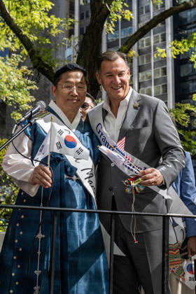 October 3, 2026, New York, New York, USA: US congressman TOM SUOZZI poses for a photo with a fellow grand mashal on the 2026 NYC Korean parade stage. New York USA - ZUMAh214 20261003_znp_h214_015 Copyright: xSDxHerzogx