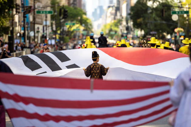 October 3, 2026, New York, New York, USA: A small child holds up their end of the Korean flag at the 2026 NYC Korean parade. New York USA - ZUMAh214 20261003_znp_h214_030 Copyright: xSDxHerzogx