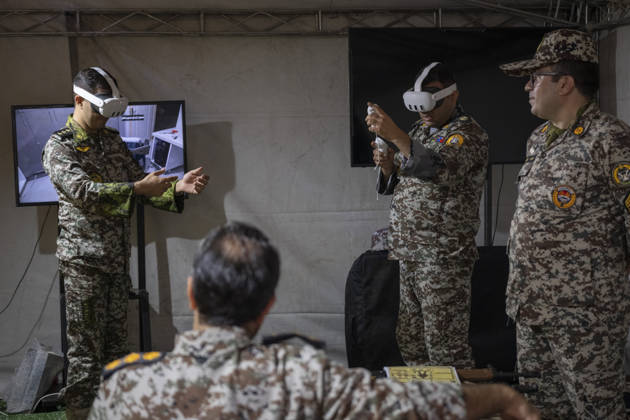 Opening Ceremony Of Second City-Square Military Training Camp Iranian Army servicemen wear virtual reality headsets to shoot with virtual rifles during the opening ceremony of the second city-square military training camp for self-sacrificing forces in downtown Tehran, Iran, on October 3, 2026. The camp was established by the Basij paramilitary force, with personnel from the Islamic Republic of Iran Army responsible for training the volunteers. Tehran Tehran Iran  Copyright: xMortezaxNikoubazlx originalFilename: nikoubazl-openingc261003_np2gu.jpg