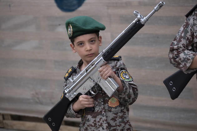 Opening Ceremony Of Second City-Square Military Training Camp An Iranian schoolboy wearing an Iranian Army military uniform holds a rifle while taking part in the opening ceremony of the second city-square military training camp for self-sacrificing forces in downtown Tehran, Iran, on October 3, 2026. The camp was established by the Basij paramilitary force, with personnel from the Islamic Republic of Iran Army responsible for training the volunteers. Tehran Tehran Iran  Copyright: xMortezaxNikoubazlx originalFilename: nikoubazl-openingc261003_npA2r.jpg