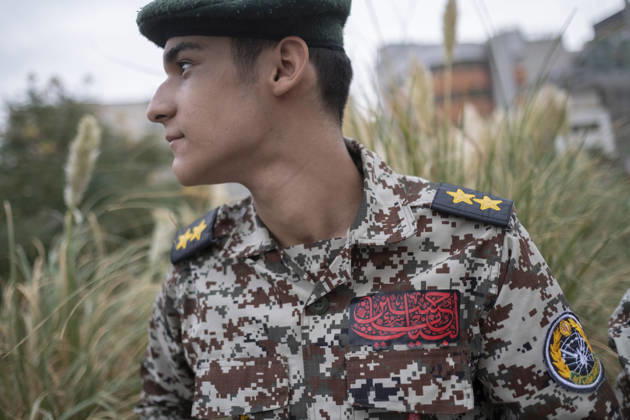 Opening Ceremony Of Second City-Square Military Training Camp An Iranian schoolboy wearing an Iranian Army military uniform looks on while preparing to take part in the opening ceremony of the second city-square military training camp for self-sacrificing forces in downtown Tehran, Iran, on October 3, 2026. The camp was established by the Basij paramilitary force, with personnel from the Islamic Republic of Iran Army responsible for training the volunteers. Tehran Tehran Iran  Copyright: xMortezaxNikoubazlx originalFilename: nikoubazl-openingc261003_npFBW.jpg