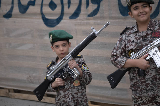 Opening Ceremony Of Second City-Square Military Training Camp Two Iranian schoolboys wearing military uniforms hold rifles during the opening ceremony of the second city-square military training camp for self-sacrificing forces in downtown Tehran, Iran, on October 3, 2026. The camp was established by the Basij paramilitary force, with personnel from the Islamic Republic of Iran Army responsible for training the volunteers. Tehran Tehran Iran  Copyright: xMortezaxNikoubazlx originalFilename: nikoubazl-openingc261003_npIPT.jpg