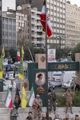 Opening Ceremony Of Second City-Square Military Training Camp An armed member of the Basij paramilitary forces stands at attention beneath an Iranian national flag during the opening ceremony of the second city-square military training camp for self-sacrificing forces in downtown Tehran, Iran, on October 3, 2026. The camp was established by the Basij paramilitary force, with personnel from the Islamic Republic of Iran Army responsible for training the volunteers. Tehran Tehran Iran  Copyright: xMortezaxNikoubazlx originalFilename: nikoubazl-openingc261003_npZFO.jpg