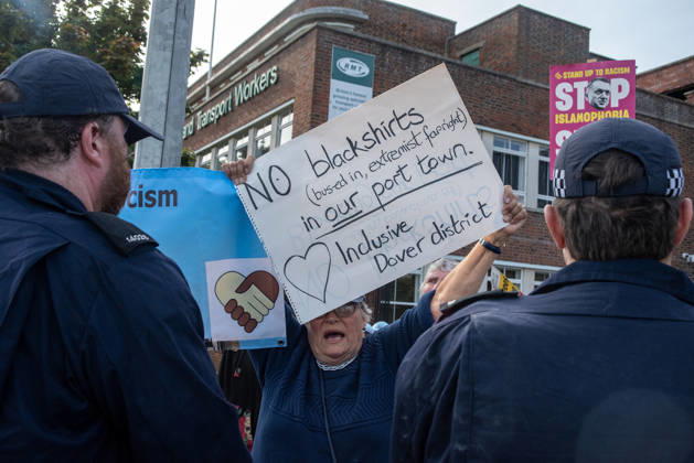 October 3, 2026, Dover, United Kingdom: An antifascist protester holds a placard and chants slogans during a counter-protest in Dover. Supporters of the English Defence League (EDL) gathered in Dover, UK to march through the town all the way to the harbour. English Defence League is an extreme far-right and Islamophobic organisation. It was founded by Tommy Robinson (pseudonym of Steven Yaxley-Lennon) in 2009. Dover United Kingdom - ZUMAs197 20261003_aaa_s197_244 Copyright: xKrisztianxElekx
