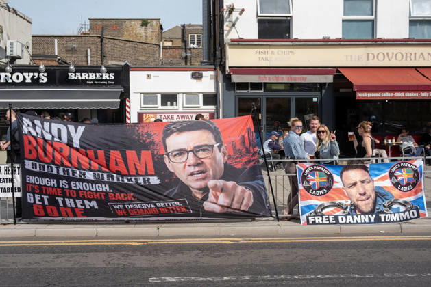 October 3, 2026, Dover, United Kingdom: Two banners installed on the fence near the Golden Lion pub during a demonstration in Dover. The left banner shows a photo of the UK Prime Minister, Andy Burnham and the right one shows a far-right activist Danny Tommo (Daniel Thomas). Supporters of the English Defence League (EDL) gathered in Dover, UK to march through the town all the way to the harbour. English Defence League is an extreme far-right and Islamophobic organisation. It was founded by Tommy Robinson (pseudonym of Steven Yaxley-Lennon) in 2009. Dover United Kingdom - ZUMAs197 20261003_aaa_s197_245 Copyright: xKrisztianxElekx