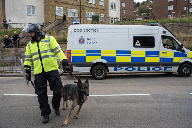 October 3, 2026, Dover, United Kingdom: A member of the police dog unit with his German Shepherd during a demonstration in Dover. Supporters of the English Defence League (EDL) gathered in Dover, UK to march through the town all the way to the harbour. English Defence League is an extreme far-right and Islamophobic organisation. It was founded by Tommy Robinson (pseudonym of Steven Yaxley-Lennon) in 2009. Dover United Kingdom - ZUMAs197 20261003_aaa_s197_251 Copyright: xKrisztianxElekx