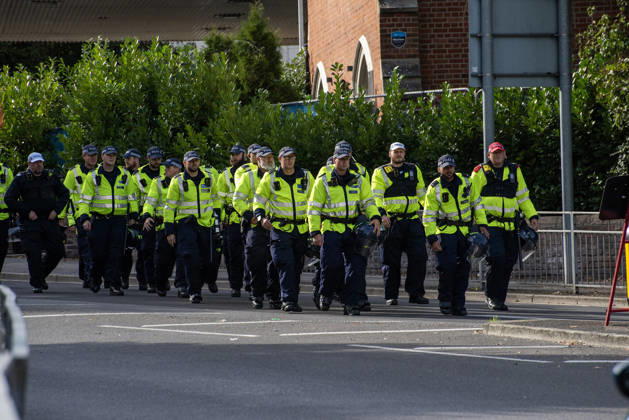 October 3, 2026, Dover, United Kingdom: Police officers march to the protest starting point in Dover. Supporters of the English Defence League (EDL) gathered in Dover, UK to march through the town all the way to the harbour. English Defence League is an extreme far-right and Islamophobic organisation. It was founded by Tommy Robinson (pseudonym of Steven Yaxley-Lennon) in 2009. Dover United Kingdom - ZUMAs197 20261003_aaa_s197_255 Copyright: xKrisztianxElekx