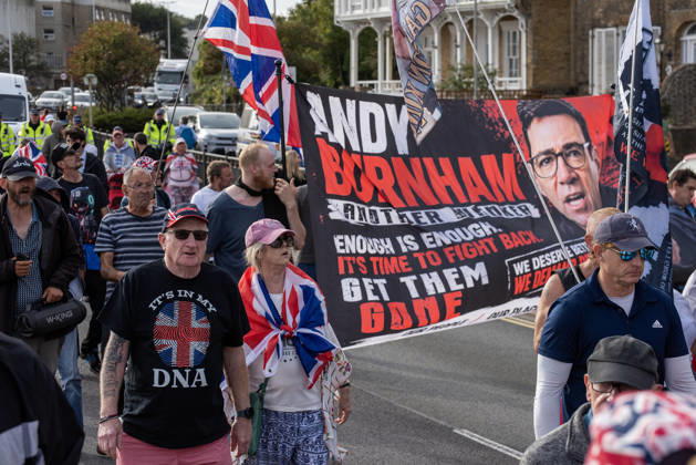 October 3, 2026, Dover, United Kingdom: Far-right protesters march with banner and flags to the harbour during a demonstration in Dover. Supporters of the English Defence League (EDL) gathered in Dover, UK to march through the town all the way to the harbour. English Defence League is an extreme far-right and Islamophobic organisation. It was founded by Tommy Robinson (pseudonym of Steven Yaxley-Lennon) in 2009. Dover United Kingdom - ZUMAs197 20261003_aaa_s197_256 Copyright: xKrisztianxElekx