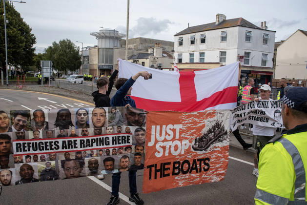October 3, 2026, Dover, United Kingdom: Far-right protesters hold banners and a St George s flag during a demonstration in Dover. Supporters of the English Defence League (EDL) gathered in Dover, UK to march through the town all the way to the harbour. English Defence League is an extreme far-right and Islamophobic organisation. It was founded by Tommy Robinson (pseudonym of Steven Yaxley-Lennon) in 2009. Dover United Kingdom - ZUMAs197 20261003_aaa_s197_257 Copyright: xKrisztianxElekx