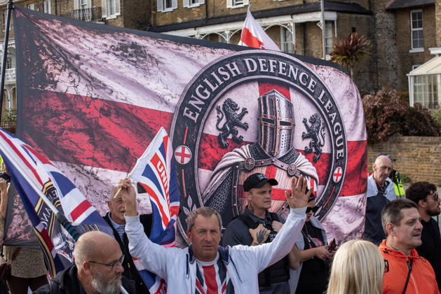 October 3, 2026, Dover, United Kingdom: Far-right protesters march with banner and flags to the harbour during a demonstration in Dover. Supporters of the English Defence League (EDL) gathered in Dover, UK to march through the town all the way to the harbour. English Defence League is an extreme far-right and Islamophobic organisation. It was founded by Tommy Robinson (pseudonym of Steven Yaxley-Lennon) in 2009. Dover United Kingdom - ZUMAs197 20261003_aaa_s197_260 Copyright: xKrisztianxElekx