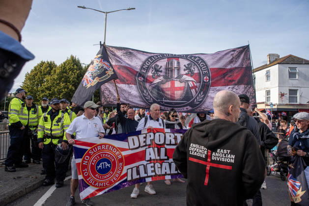 October 3, 2026, Dover, United Kingdom: Far-right protesters march with banner and flags to the harbour during a demonstration in Dover. Supporters of the English Defence League (EDL) gathered in Dover, UK to march through the town all the way to the harbour. English Defence League is an extreme far-right and Islamophobic organisation. It was founded by Tommy Robinson (pseudonym of Steven Yaxley-Lennon) in 2009. Dover United Kingdom - ZUMAs197 20261003_aaa_s197_264 Copyright: xKrisztianxElekx