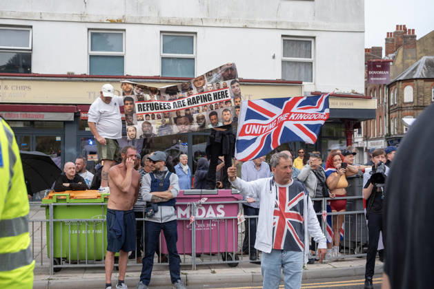 October 3, 2026, Dover, United Kingdom: Far-right protesters hold a banner and wave a St George s flag during a demonstration in Dover. Supporters of the English Defence League (EDL) gathered in Dover, UK to march through the town all the way to the harbour. English Defence League is an extreme far-right and Islamophobic organisation. It was founded by Tommy Robinson (pseudonym of Steven Yaxley-Lennon) in 2009. Dover United Kingdom - ZUMAs197 20261003_aaa_s197_268 Copyright: xKrisztianxElekx