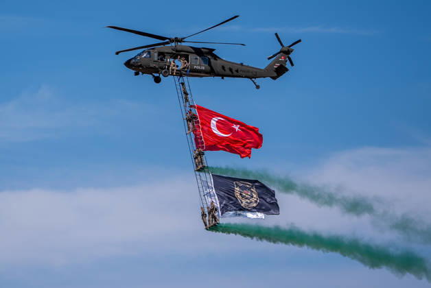 TEKNOFEST Southeast in Turkiye s Sanliurfa SANLIURFA, TURKIYE - OCTOBER 4: Soldiers aboard an S-70 helicopter wave a Turkish flag during a flag flyover at the Aviation, Space and Technology Festival (TEKNOFEST), world s largest aviation, space, and technology festival at the Sanliurfa GAP Airport for its 15th edition in Sanliurfa, Turkiye on October 4, 2026. Arman Onal Anadolu Sanliurfa Turkey. Editorial use only. Please get in touch for any other usage.  Copyright: x2026xAnadoluxArmanxOnalx