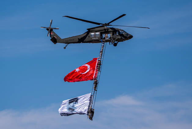 TEKNOFEST Southeast in Turkiye s Sanliurfa SANLIURFA, TURKIYE - OCTOBER 4: Soldiers aboard an S-70 helicopter wave a Turkish flag during a flag flyover at the Aviation, Space and Technology Festival (TEKNOFEST), world s largest aviation, space, and technology festival at the Sanliurfa GAP Airport for its 15th edition in Sanliurfa, Turkiye on October 4, 2026. Arman Onal Anadolu Sanliurfa Turkey. Editorial use only. Please get in touch for any other usage.  Copyright: x2026xAnadoluxArmanxOnalx