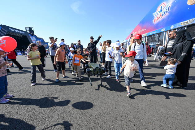 TEKNOFEST Southeast in Turkiye s Sanliurfa SANLIURFA, TURKIYE - OCTOBER 04: Children interact with a quadruped robot during TEKNOFEST, Turkiye s premier technology and aerospace event, at Sanliurfa GAP Airport in Sanliurfa, Turkiye, on October 04, 2026. The festival is organized by the Turkish Ministry of Industry and Technology and the T3 Foundation, with Anadolu serving as its Global Communication Partner. Adsiz Gunebakan Anadolu Sanliurfa Turkey. Editorial use only. Please get in touch for any other usage.  Copyright: x2026xAnadoluxAdsizxGunebakanx