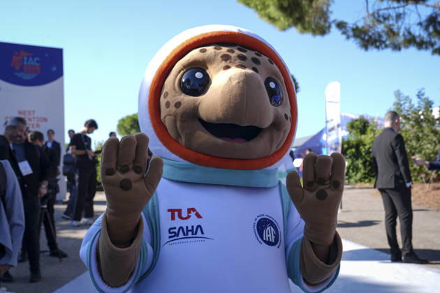World’s largest annual gathering dedicated to space opens in Turkiye’s Antalya ANTALYA, TURKIYE - OCTOBER 05: Turquoise, the official Caretta caretta mascot of the 77th International Astronautical Congress (IAC), interacts with delegates during the opening day of the global summit at the NEST Convention Center in Antalya, Turkiye on October 05, 2026. Organized by the International Astronautical Federation (IAF), coordinated by the Turkish Ministry of Industry and Technology, and co-hosted by the Turkish Space Agency (TUA) and SAHA Istanbul, the event features the mascot welcoming space professionals and attendees from around the world. Beyza Comert Anadolu Antalya Turkey. Editorial use only. Please get in touch for any other usage.  Copyright: x2026xAnadoluxBeyzaxComertx