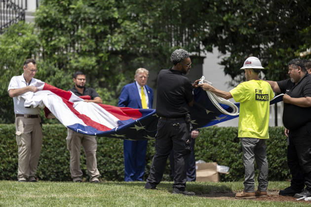 October 5, 2026, Washington, Dc, United States of America: U.S. President Donald Trump watches as workers unfurl an American flag to be raised on a newly installed flagpole on the South Lawn of the White House, June 18, 2025 in Washington, D.C. The flag was raised on one of two new flagpoles Trump had installed on the North and South Lawns of the White House, which he said he paid for personally. Washington United States of America - ZUMAp138 20261005_zaa_p138_085 Copyright: xMollyxRiley WhitexHousex