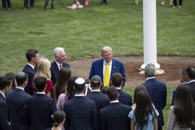 October 5, 2026, Washington, Dc, United States of America: U.S. President Donald Trump speaks with guests at the base of the newly installed flagpole on the South Lawn of the White House, June 18, 2025 in Washington, D.C. The flag was raised on one of two new flagpoles Trump had installed on the North and South Lawns of the White House, which he said he paid for personally. Washington United States of America - ZUMAp138 20261005_zaa_p138_086 Copyright: xMollyxRiley WhitexHousex