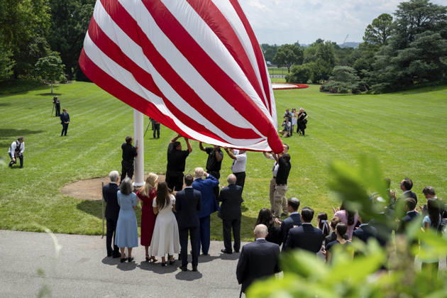 October 5, 2026, Washington, Dc, United States of America: An American flag is raised on a newly installed flagpole on the South Lawn of the White House as U.S. President Donald Trump, family members and guests look on, June 18, 2025 in Washington, D.C. The flag was raised on one of two new flagpoles Trump had installed on the North and South Lawns of the White House, which he said he paid for personally. Washington United States of America - ZUMAp138 20261005_zaa_p138_076 Copyright: xMollyxRiley WhitexHousex